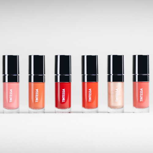 Set of Tintessa lip and cheek tints in various shades on a white background